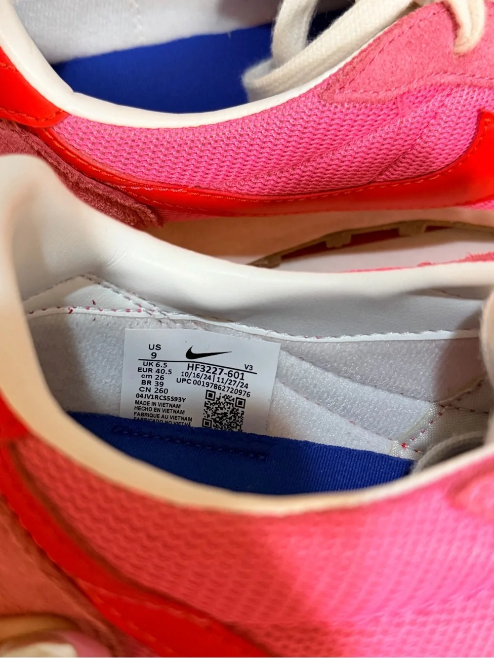 Nike Women's Pink Sneakers with Orange Swoosh